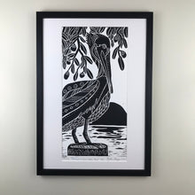 Load image into Gallery viewer, Brown Pelican and Live Oaks, limited edition black and white block print. Hand pulled on 12x18 paper