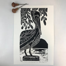 Load image into Gallery viewer, Brown Pelican and Live Oaks, limited edition black and white block print. Hand pulled on 12x18 paper