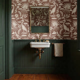 Tropical bird and palm leaf pattern in cream on terracotta brown background