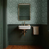 Ornate Art Nouveau floral pattern with stylized lotus flowers and foliage in sage green tones