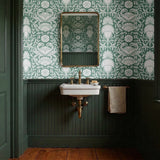 Symmetrical sea-themed pattern in sage green and white featuring crabs, starfish, shells, and marine