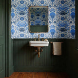 Symmetrical blue and white maritime pattern with starfish, crabs, shells, and fish motifs