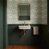Symmetrical art nouveau botanical pattern with protea flowers, moths, and foliage in sage green on c