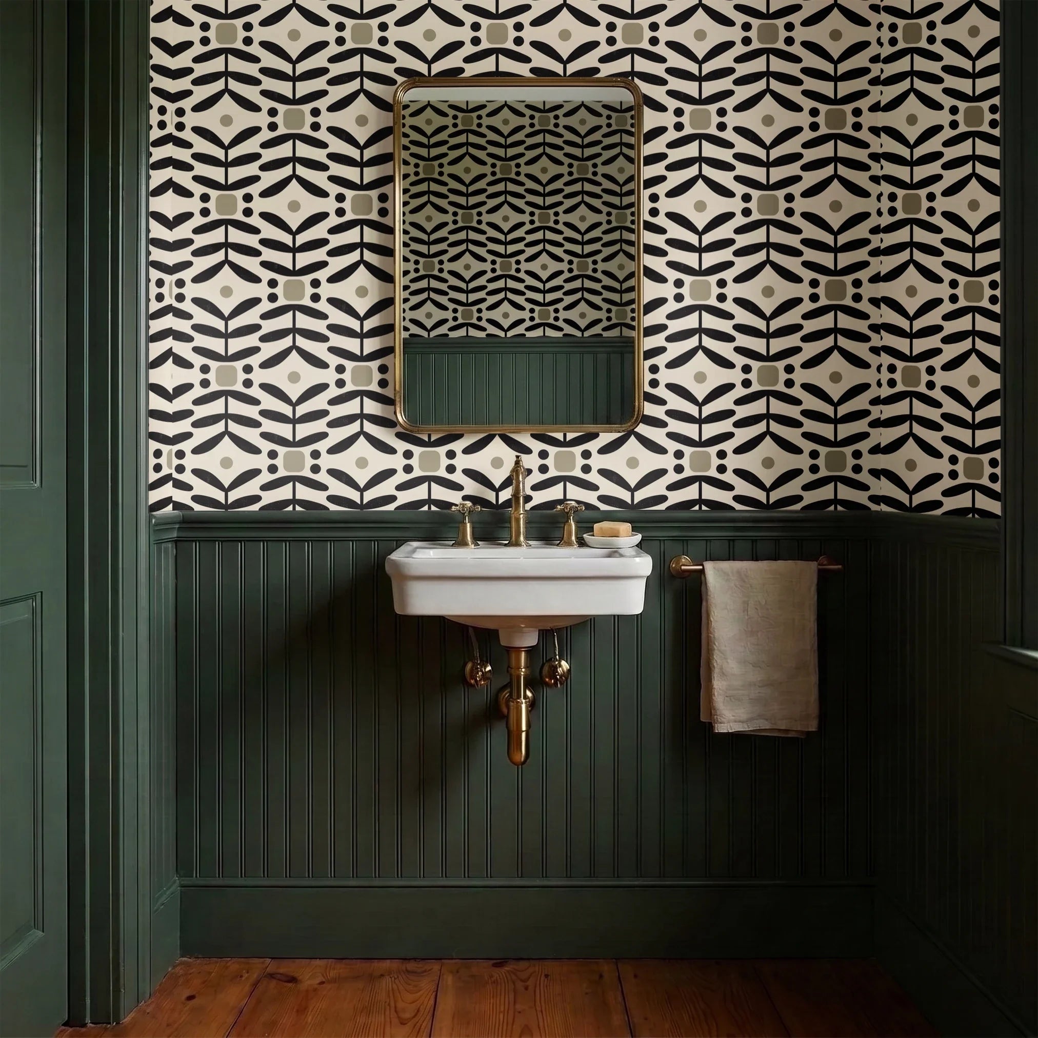 Geometric pattern with black botanical motifs and tan circles on cream background