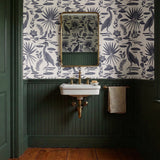 Tropical botanical pattern with blue herons, palm fronds, and foliage on cream background
