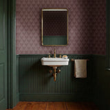 Art deco style pattern with stylized pinecones and fan shapes in muted rose and mauve tones