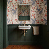 Decorative pattern with blue herons, beige cranes, and red flowers on cream background