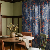 Blue wallpaper pattern with gray cranes, red flowers, and beige cattails in an Asian-inspired design