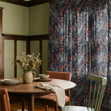Herons and cranes among red flowers and reeds on dark blue background in decorative pattern