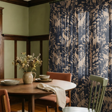 Herons and cranes among reeds and flowers in beige on dark navy blue background