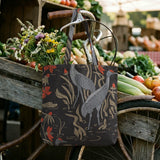 Decorative pattern with gray herons, red flowers, and beige foliage on dark background