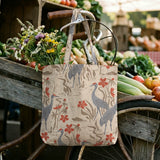 Herons and cranes among red flowers and beige foliage in Asian-inspired decorative pattern