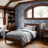 Symmetrical decorative pattern with crabs, starfish, and seashells in blue and gold tones