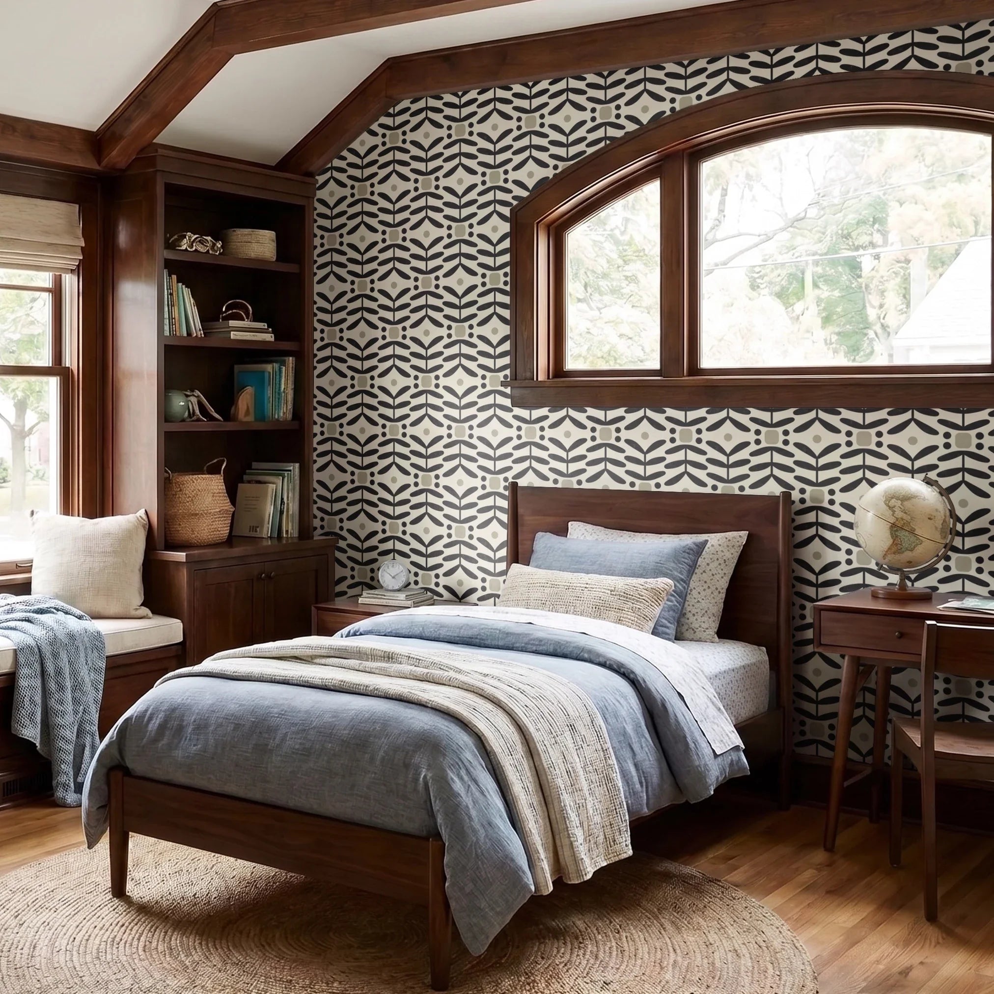 Geometric pattern with black botanical motifs and tan circles on cream background