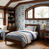 Symmetrical coastal pattern with crab, starfish, seashells, and seaweed in blue, brown, and pink ton