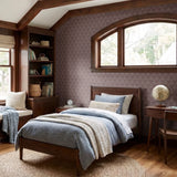 Art deco style pattern with stylized pinecones and fan shapes in muted rose and mauve tones