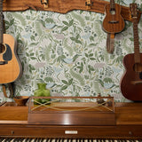 Decorative botanical pattern with green ferns, leaves, mushrooms, and flowers on cream background