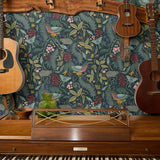 Dark botanical pattern with birds, hedgehogs, flowers and foliage in muted tones