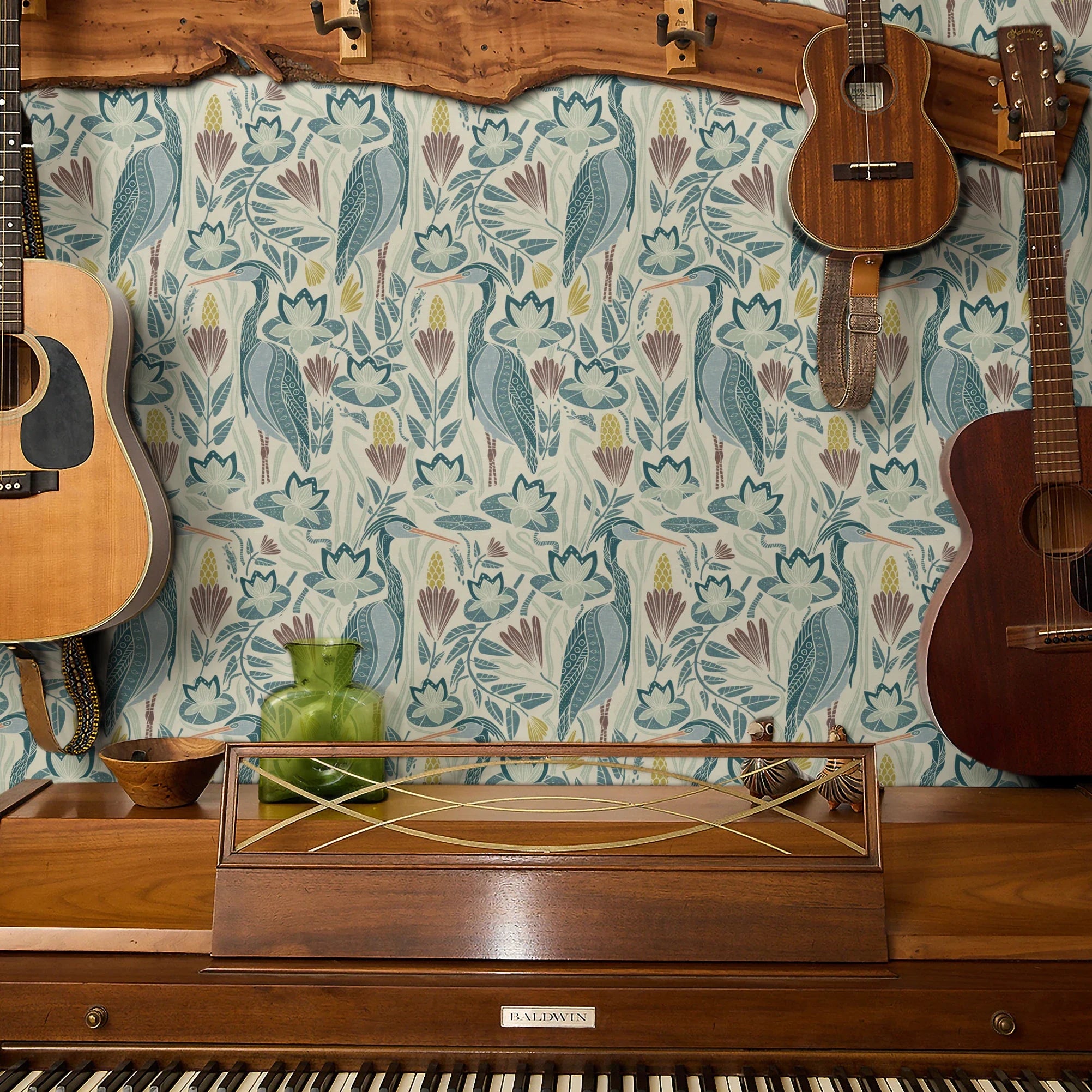Decorative pattern with blue birds, lotus flowers, and foliage in muted teal, mauve, and cream tones