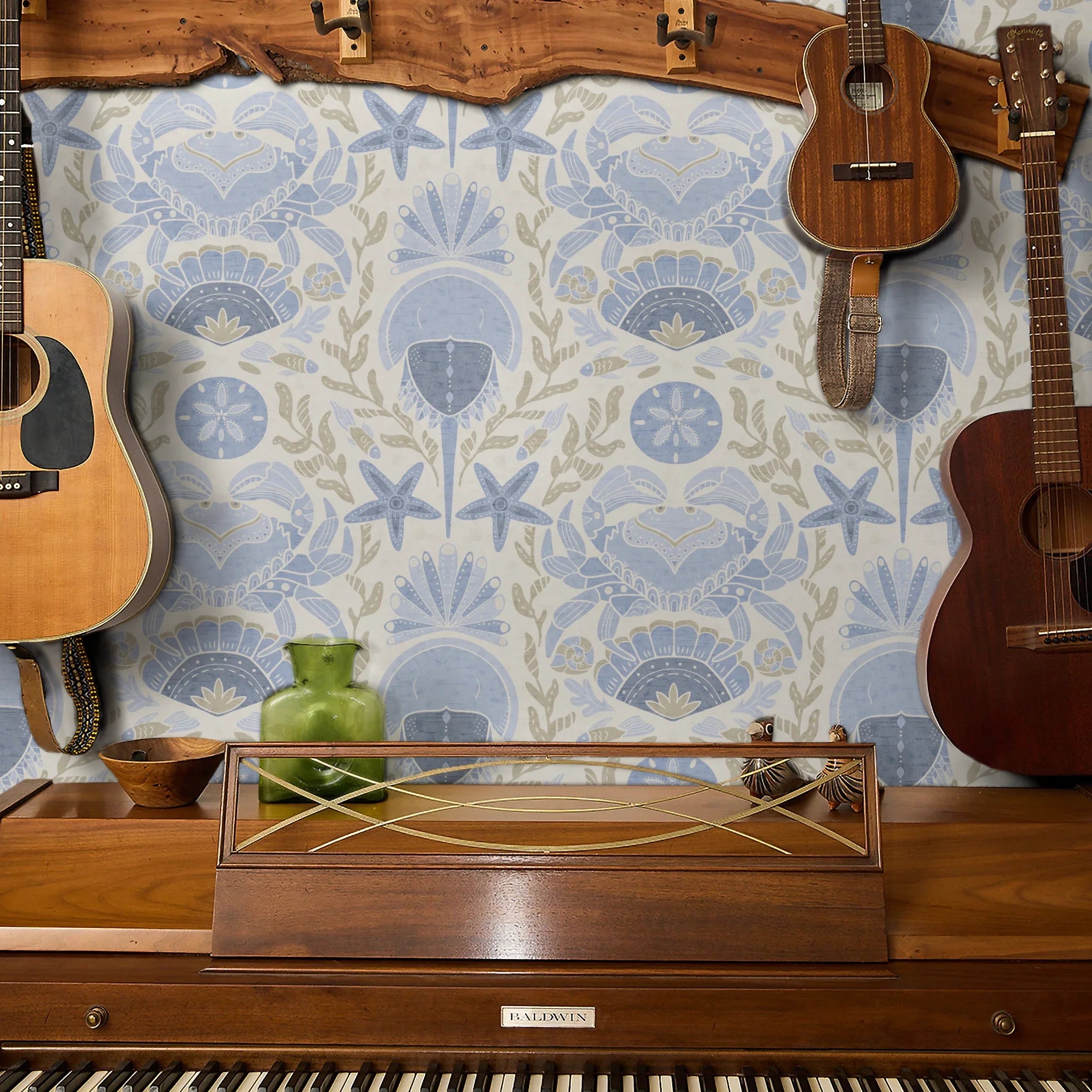 Symmetrical coastal damask pattern with crabs, starfish, shells, and seaweed in blue and tan