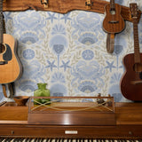 Symmetrical coastal damask pattern with crabs, starfish, shells, and seaweed in blue and tan