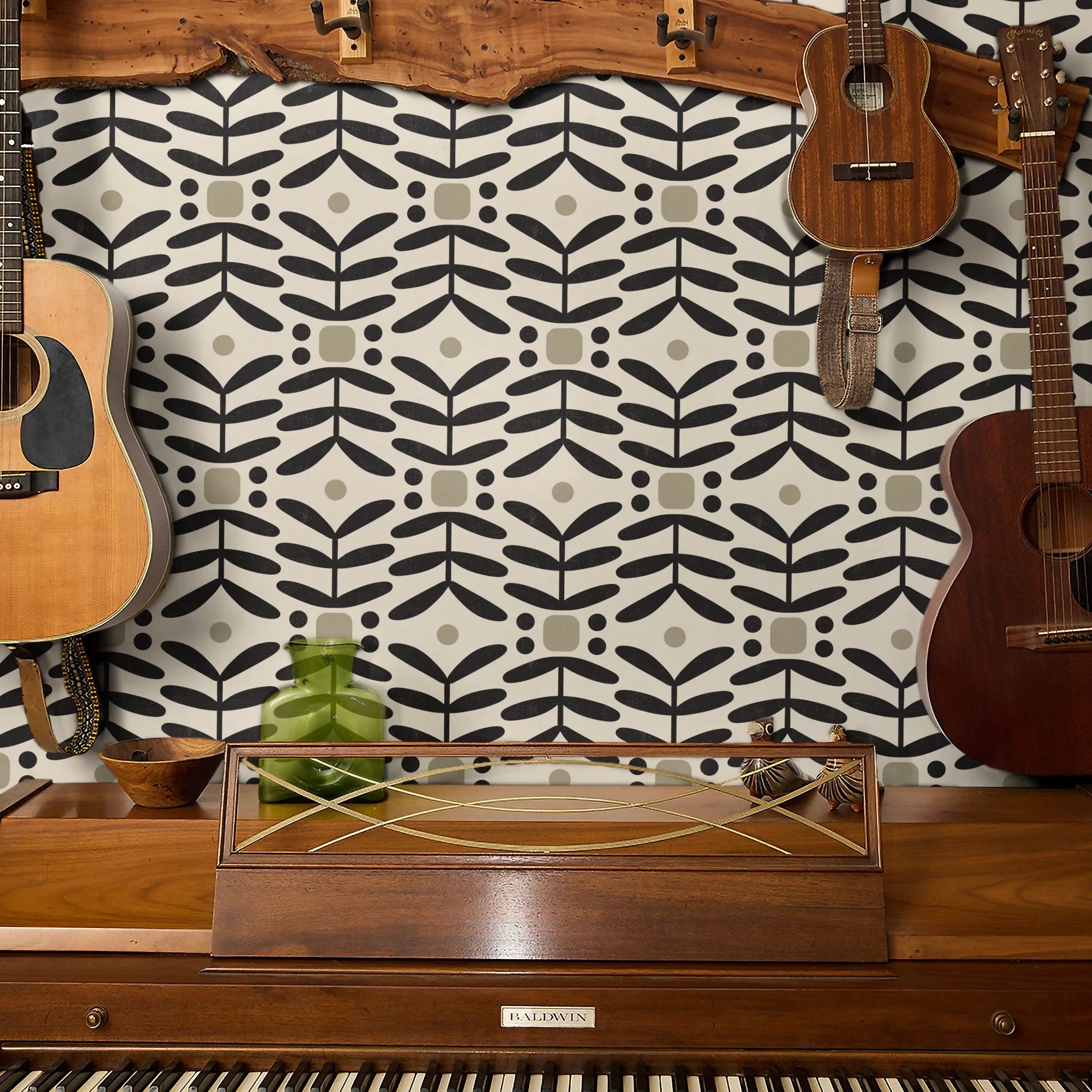 Geometric pattern with black botanical motifs and tan circles on cream background