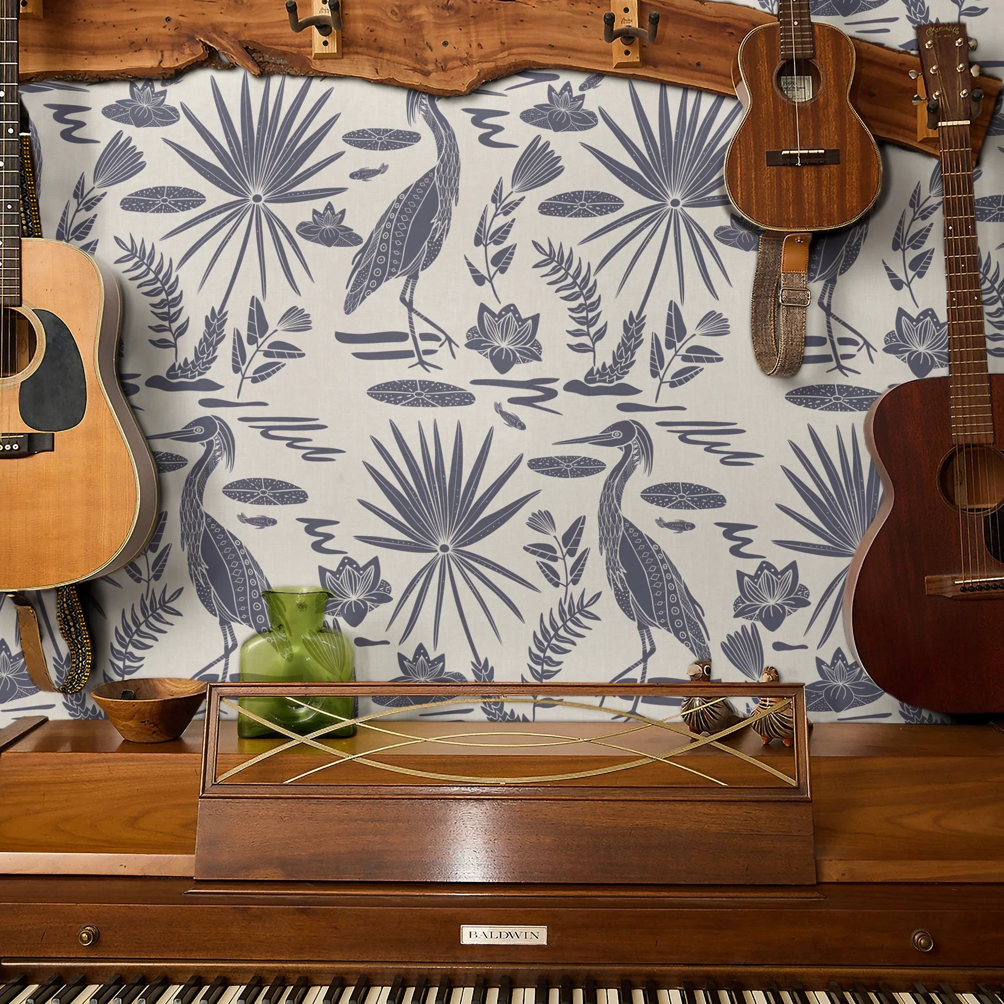 Tropical botanical pattern with blue herons, palm fronds, and foliage on cream background