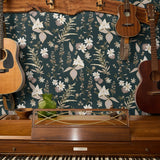 Vintage botanical pattern with cream and pink flowers on dark green background