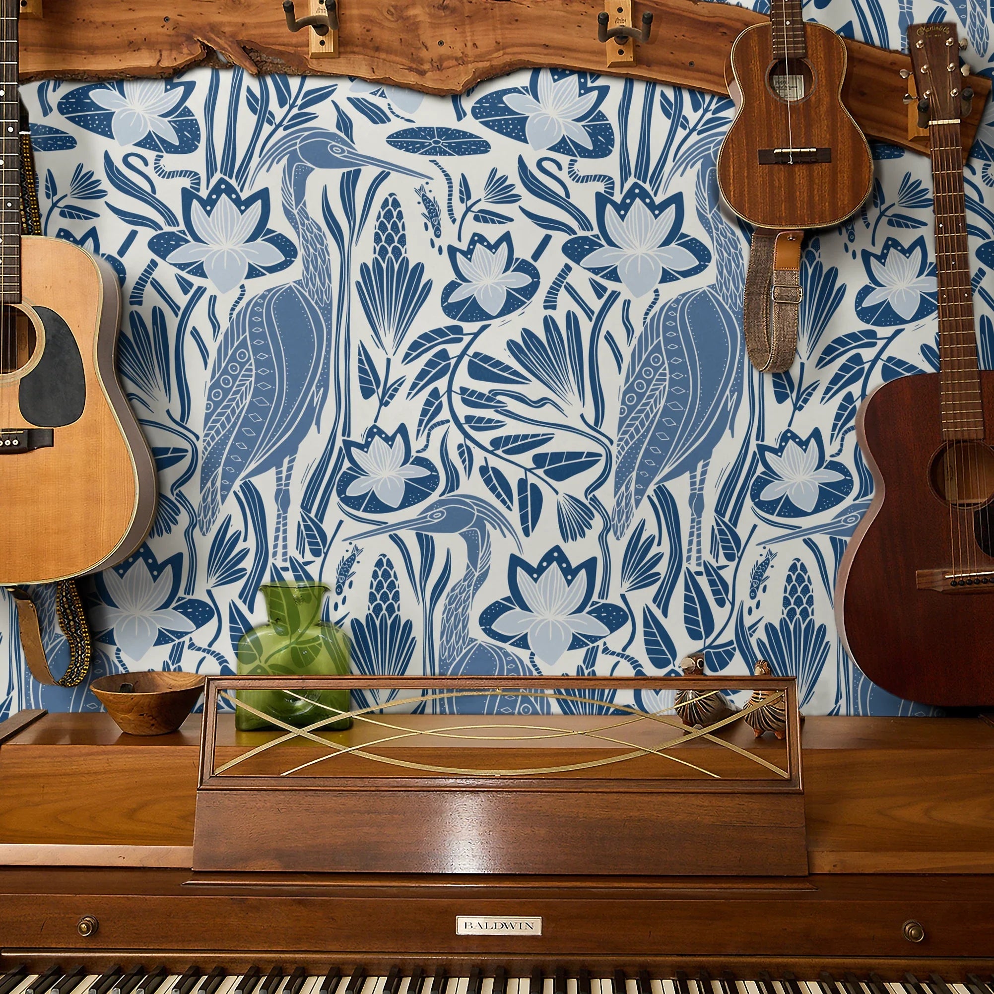 Blue and white decorative pattern with birds, flowers, and foliage in folk art style