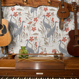 Decorative pattern with gray herons, beige rabbits, and coral-red flowers on white background