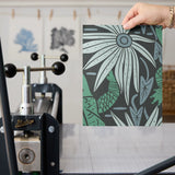Tropical pattern with green alligators, palm fronds, and coral flowers on dark background