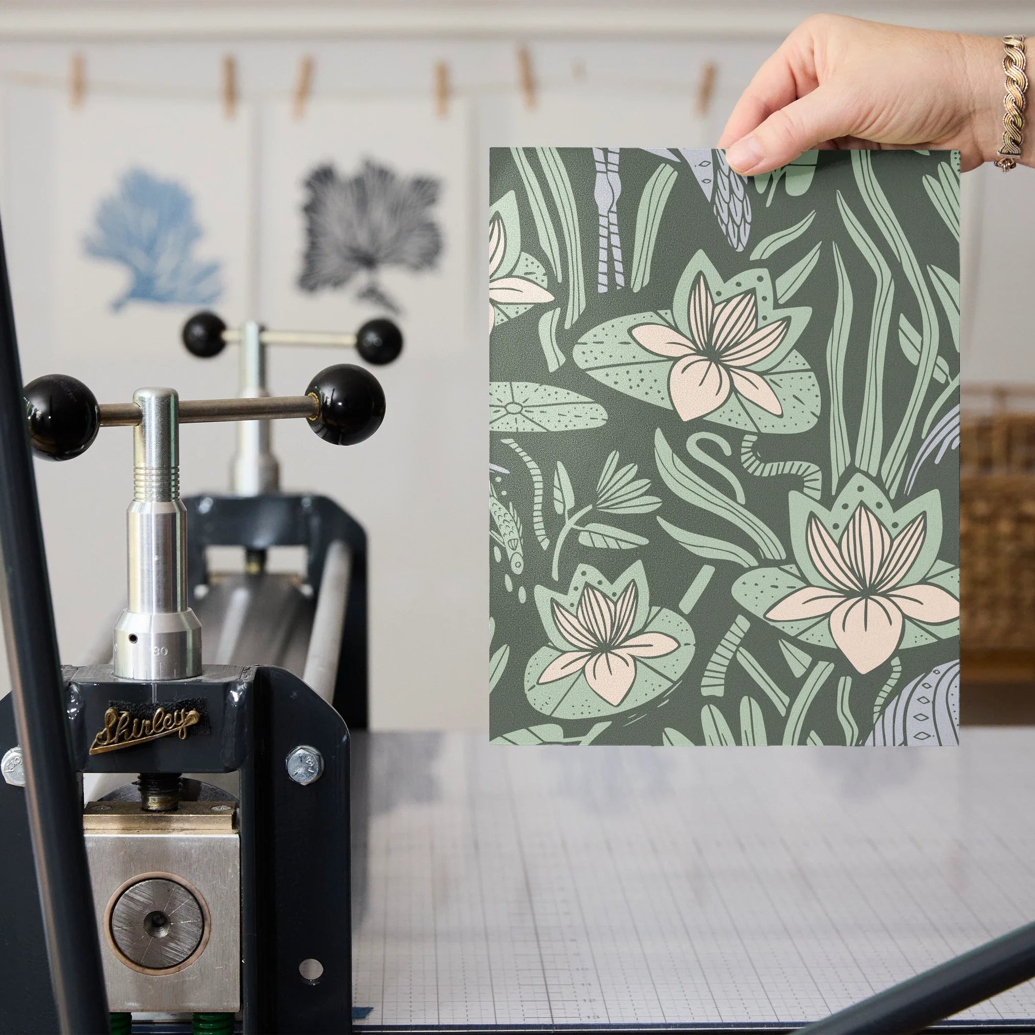 Art Nouveau pattern with herons, water lilies, and reeds in green, white, and lavender tones