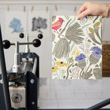 Decorative pattern with birds, flowers, and foliage in muted colors on cream background