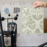 Symmetrical art nouveau botanical pattern with protea flowers, moths, and foliage in sage green on c