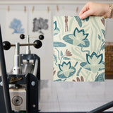 Decorative pattern with blue birds, lotus flowers, and foliage in muted teal, mauve, and cream tones