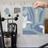Art Nouveau floral pattern with white lilies, blue-green leaves and organic flowing design