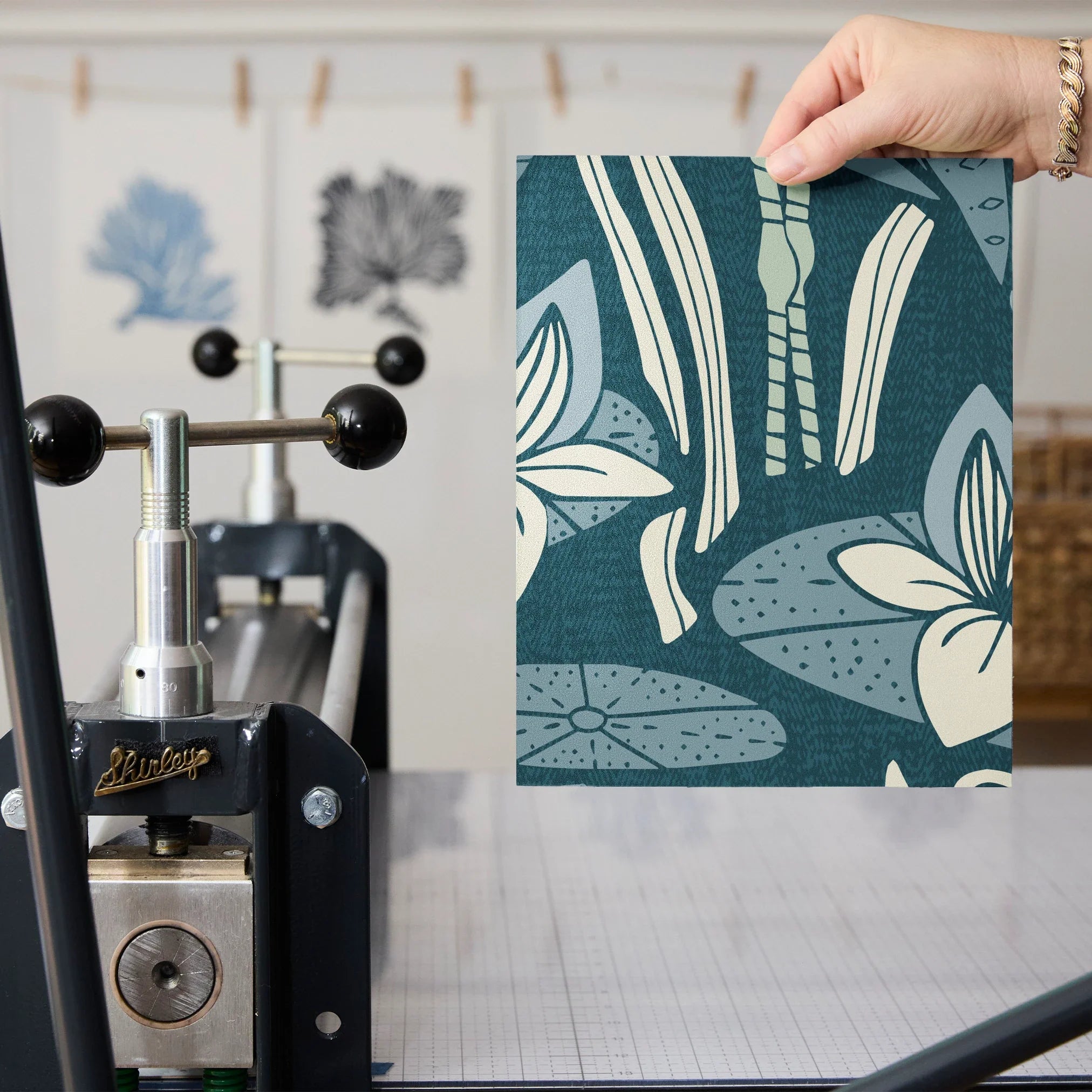 Blue-green botanical pattern with stylized flowers, leaves, and swans in Art Nouveau style