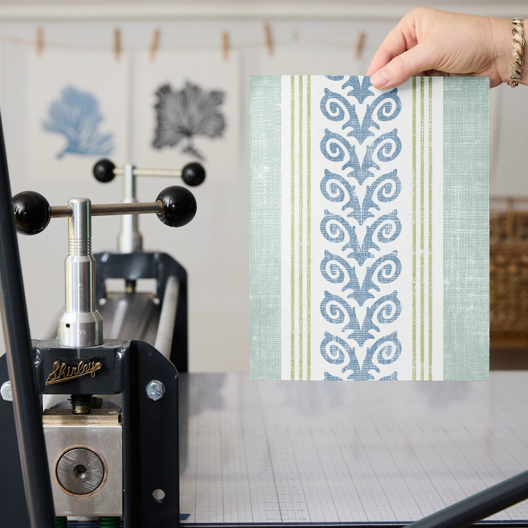 Vertical stripes with blue floral vine pattern on cream and light blue background