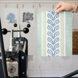 Vertical stripes with blue floral vine pattern on cream and light blue background