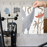 Decorative pattern with gray herons, beige rabbits, and coral-red flowers on white background