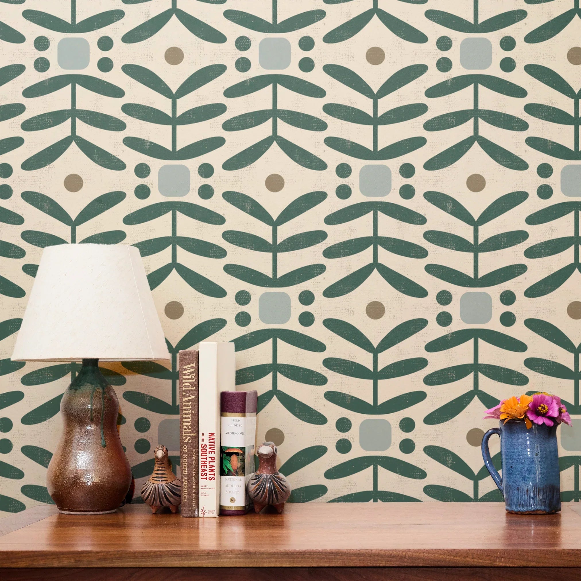 Geometric botanical pattern with teal green leaves, circles, and gray squares on cream background