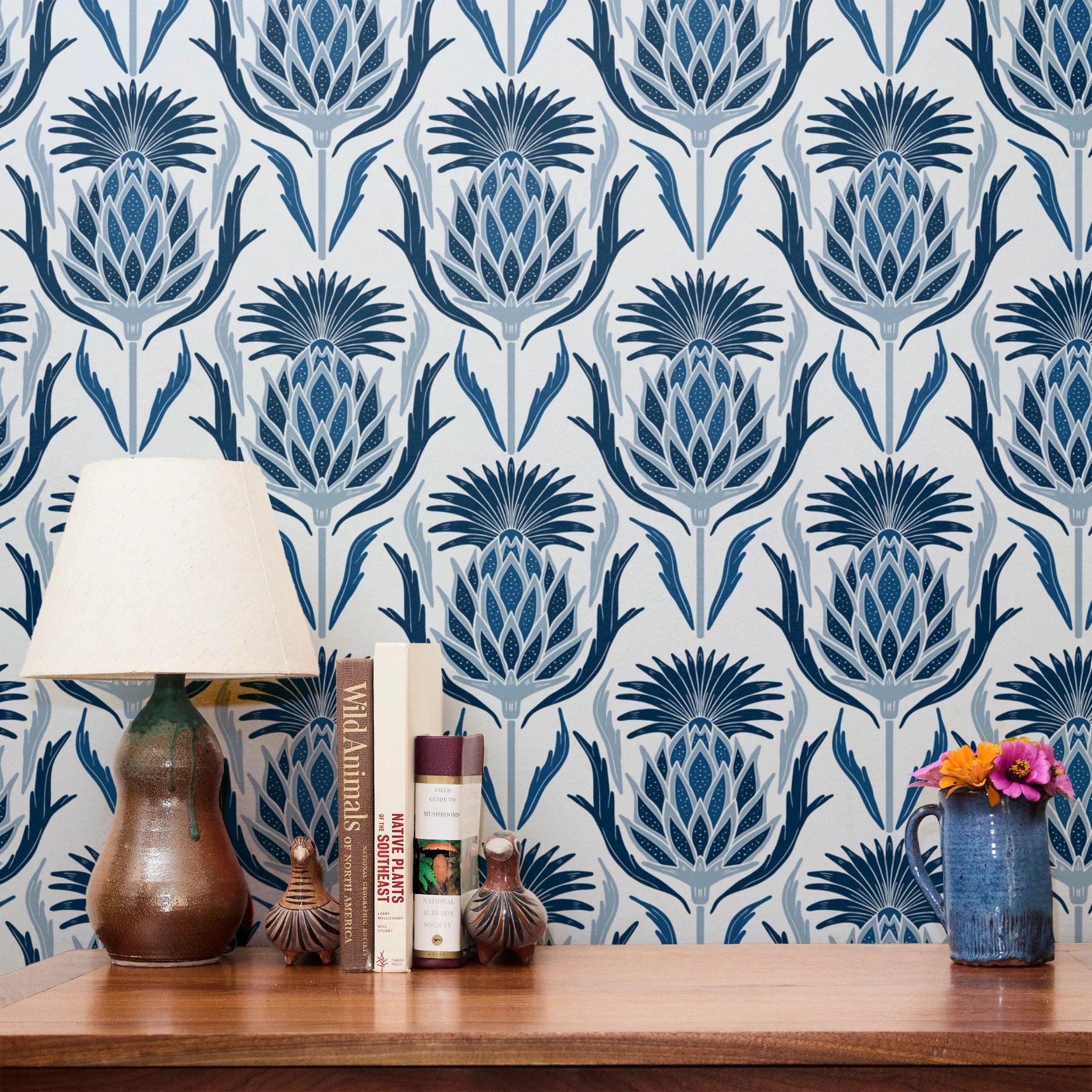 Decorative damask pattern with blue pineapple and palm motifs on white background