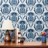 Decorative damask pattern with blue pineapple and palm motifs on white background