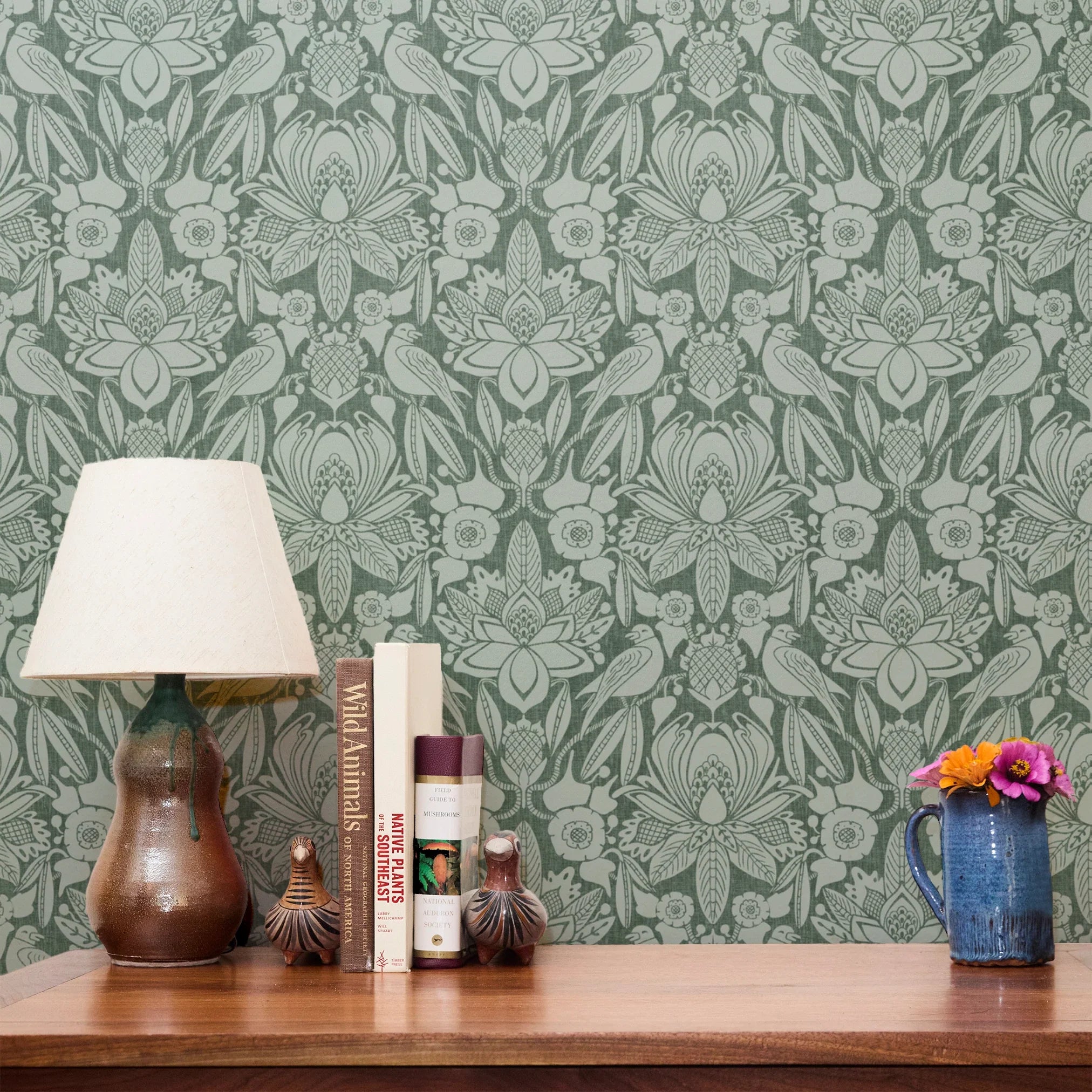 Ornate Art Nouveau floral pattern with stylized lotus flowers and foliage in sage green tones