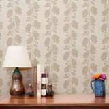 Beige oak leaf pattern on cream textured background with acorns and branches