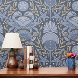 Symmetrical decorative pattern with crabs, starfish, and seashells in blue and gold tones