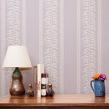 White feather and chevron pattern stripes on soft purple background
