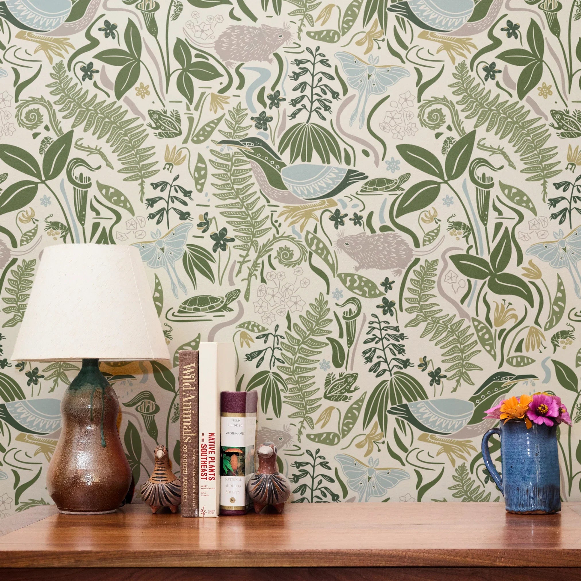 Decorative botanical pattern with green ferns, leaves, mushrooms, and flowers on cream background