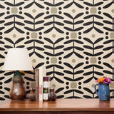 Geometric pattern with black botanical motifs and tan circles on cream background