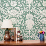 Symmetrical sea-themed pattern in sage green and white featuring crabs, starfish, shells, and marine